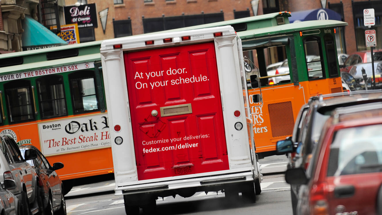 FedEx print ad with text - At your door. On your schedule.